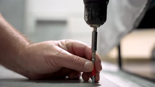 Hand Assembling Furniture with Power Drill