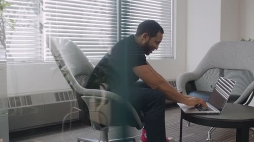 Creative Businessman Using Laptop in Office 4044 Years