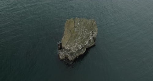 Aerial view of a rock in the sea, Iceland.
