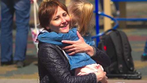 Happy mother and daughter at the playground