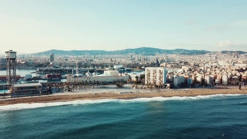 Barceloneta Beach and Cityscape on a Sunny Day