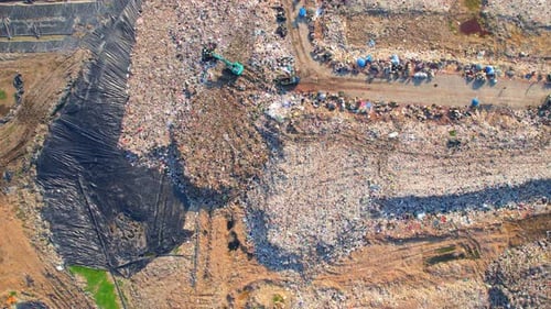 4K : Aerial view from a drone flying over a large pile of garbage