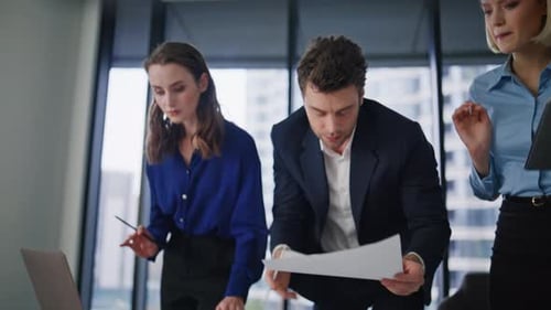 Office Staff Reviewing Financial Statistic Working in Company Workplace Closeup