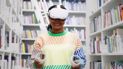 African American Student Using Virtual Reality Glasses in the Library