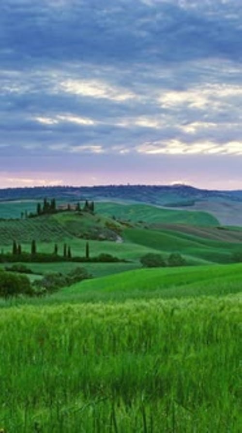 Tuscany landscape sunrise farm house and hills
