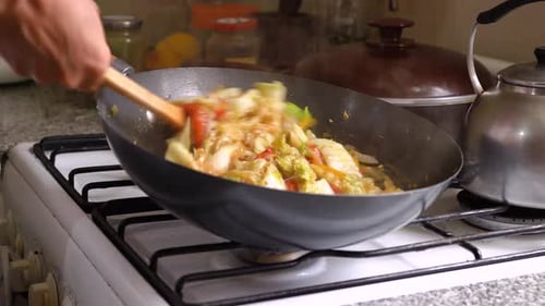 Cooking Mixed Vegetables In A Wok With Napa Cabbage. close up