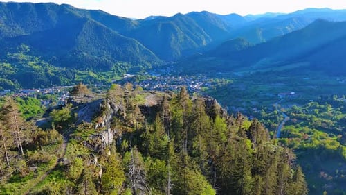 View From Rock to Town of Smolyan with Meadows for Cattle Walking and Houses Between Mountain Range