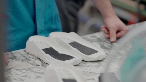 Craftsmen Working on 3D Printed Shoe Soles
