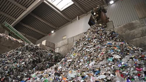 Large Pile of Waste Inside Trash Sorting Facility