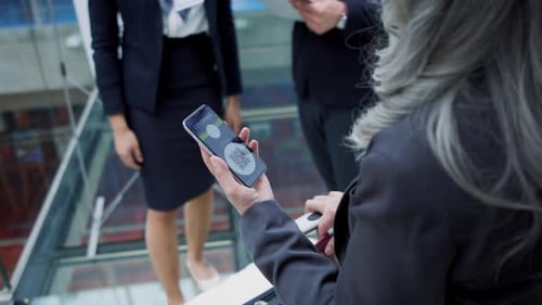 Woman Displays Covid Pass on Phone at Airport