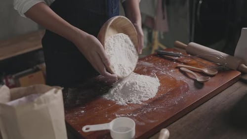 baker pour the mixture to hand make bread according formula at store
