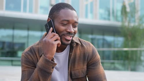 African American Man Talking on Smartphone on Street in City Outdoor Man with Cell Phone Chatting