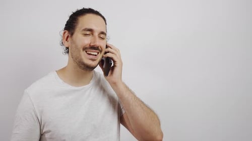 Man Talking on Cell Phone and Smiling