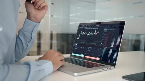 Stock Trading Investor Analyzing Trading Financial Market on Laptop Close Up