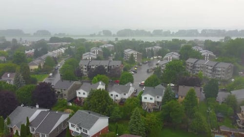Aerial shot of a residential community in Montreal under heavy rain