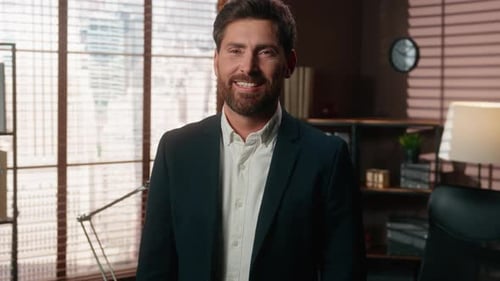 Funny Emotional Caucasian Middleaged Business Man Looking at Camera Laughing with Evil Raising Hands