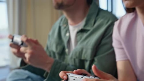 Couple Playing Video Games at Home Together