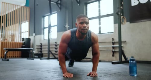 Man, fitness and push ups in workout, strength or exercise on floor for endurance at gym