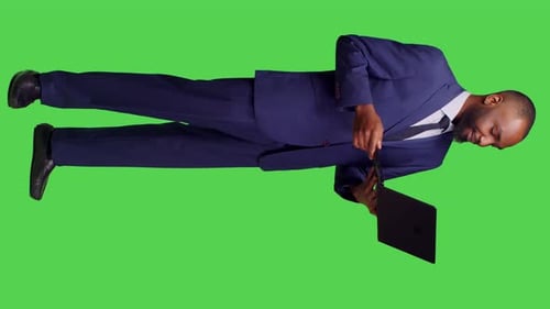 Vertical Video Side View of African American Man Attending Videocall Meeting on Pc