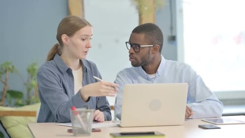 Creative Businesswoman Talking with African Businessman