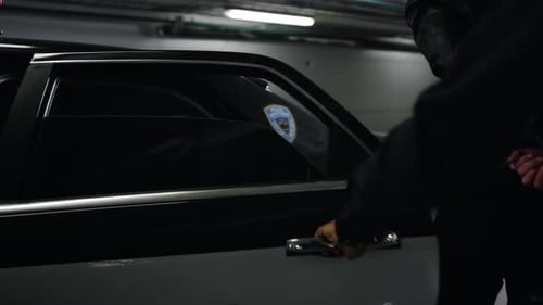 Man arrested and placed in police car