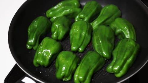 Fresh Green Bell Peppers in Pan, Close Up