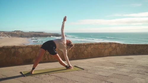 Yoga Exercises Ocean View on Background