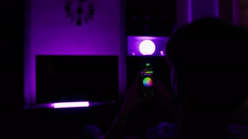 Adult Controlling Smart Home Lighting with Smartphone