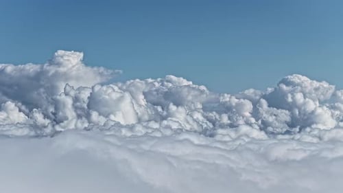 Cumulonimbus clouds high altitude aerial plane window view atmosphere