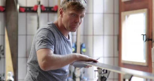 Craftsperson working in snowboard workshop