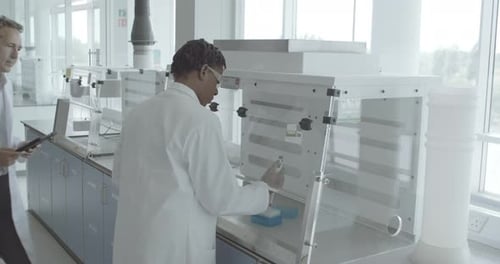 Scientists Working in Modern Laboratory Environment