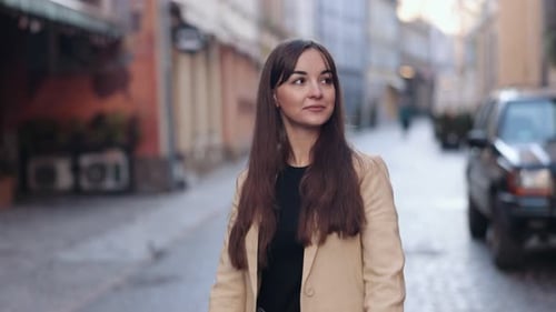 Woman Using Cell Phone on City Street