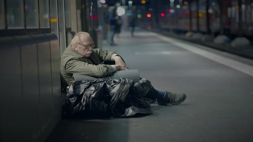 Elderly Homeless Man Suffering From Poverty Looking for Help at Train Station
