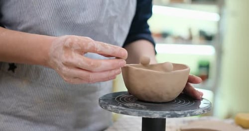 Woman Forming Clay Pot Shape By Hands Closeup in Artistic Studio