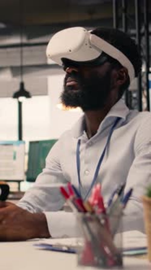 Vertical Video Black Professional Using VR Glasses in Corporate Office Environment