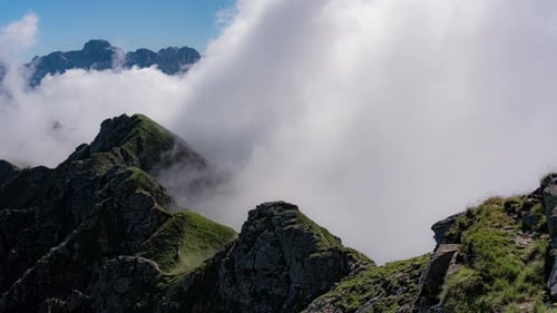 Cloudy mountain landscape timelapse. Big volume of clouds moving and covering the sky. Shot on Cima