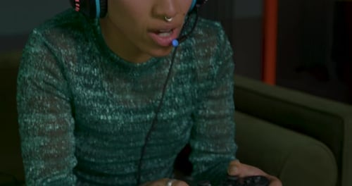 Young Adult Playing Video Games with Headset