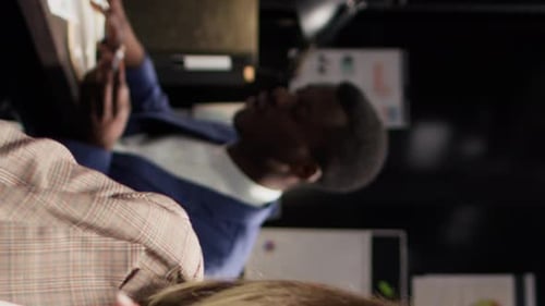 Man and Woman Discussing Work in Office