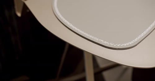 Close Up Work Table with Leather and White Stitching Wood on a Comfortable Room