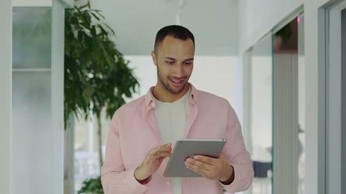 Boss Walking in the Office Using Digital Tablet Successful Manager Working on Device