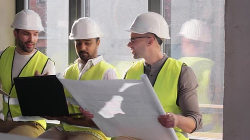 Architecture, Construction Business and People Concept - Male Architects in Helmets With