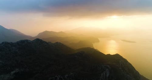 sea and sunrise over the mountains at sunrise