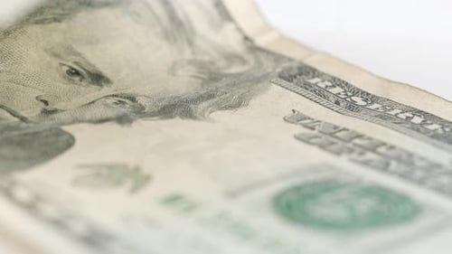 Shot Of American Twenty Dollar Bill Rotating Slowly. Low Angle