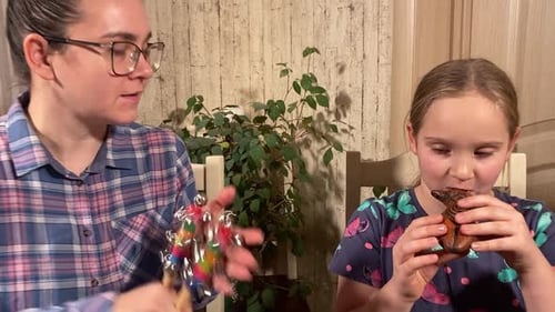 Child and Woman Playing Musical Instruments Together