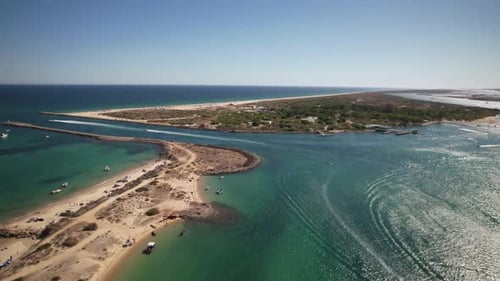 Aerial View of Beach and Ocean on Sunny Day