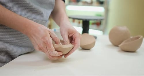 Woman Forming Clay Pot Shape By Hands Closeup in Artistic Studio