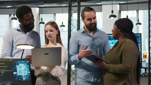 Team of Programmers in Office Automating Repetitive Tasks Using AI Scripts