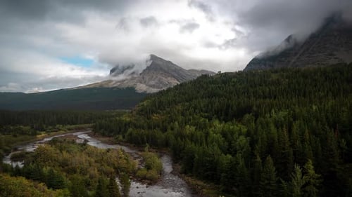 Time Lapse, Dramatic Clouds Above Majestic Pristine Mountains Landscape, Forest, Glacial River and P