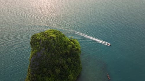 An Aerial View of Krabi Thailand During a Stunning Sunset Featuring a Longtail Boat