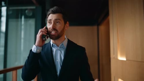 Angry Boss Yelling Cellphone Walking Business Center Hallway Emotionally Closeup